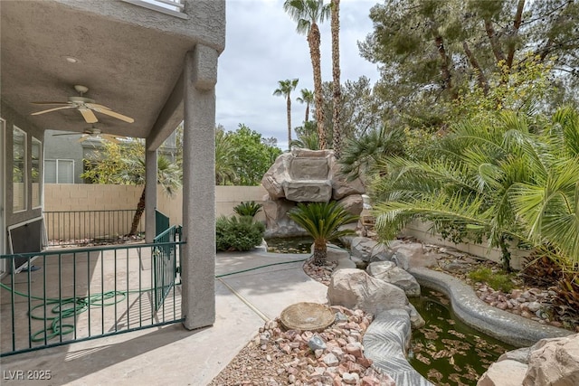 9705 Floweret Ave, Las Vegas, NV 89117 - fenced backyard featuring ceiling fan and a patio