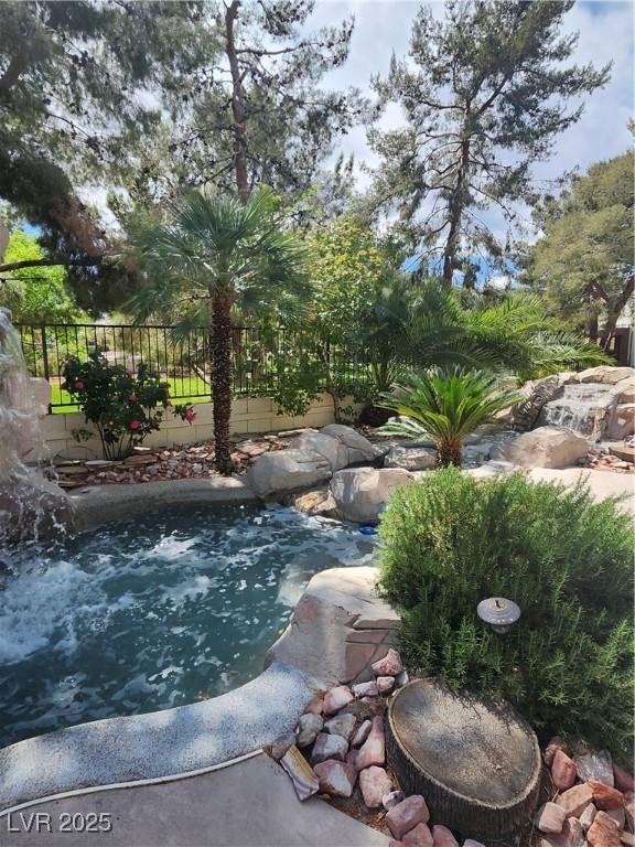 9705 Floweret Ave, Las Vegas, NV 89117 - view of swimming pool with a jacuzzi
