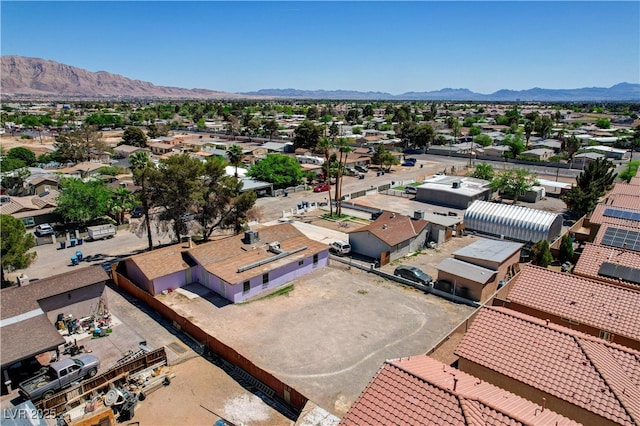 birds eye view of property with a mountain view and a residential view