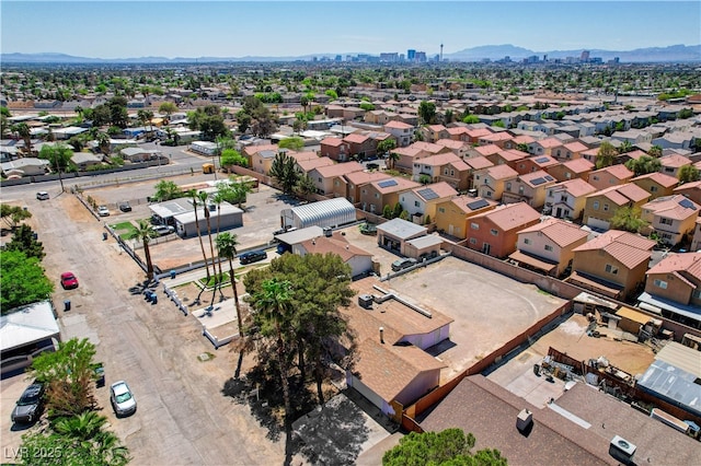 drone / aerial view featuring a mountain view and a residential view