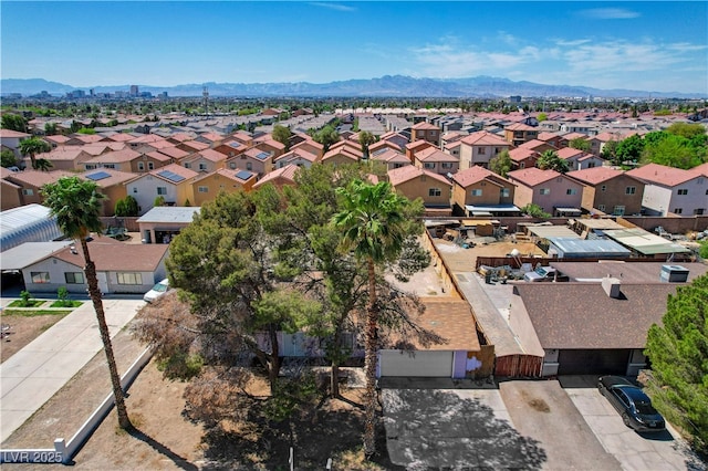 birds eye view of property with a mountain view and a residential view