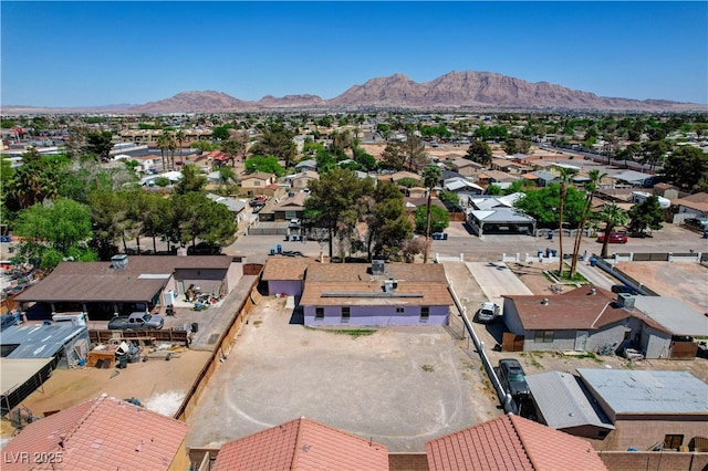 drone / aerial view featuring a residential view and a mountain view