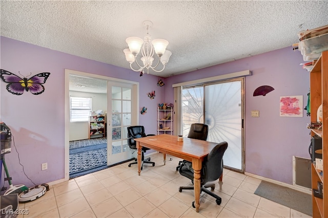 office area featuring a wealth of natural light, a chandelier, baseboards, and a textured ceiling