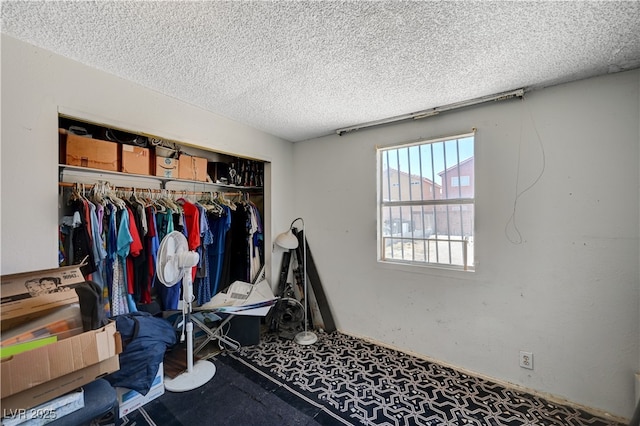 bedroom with a closet and a textured ceiling