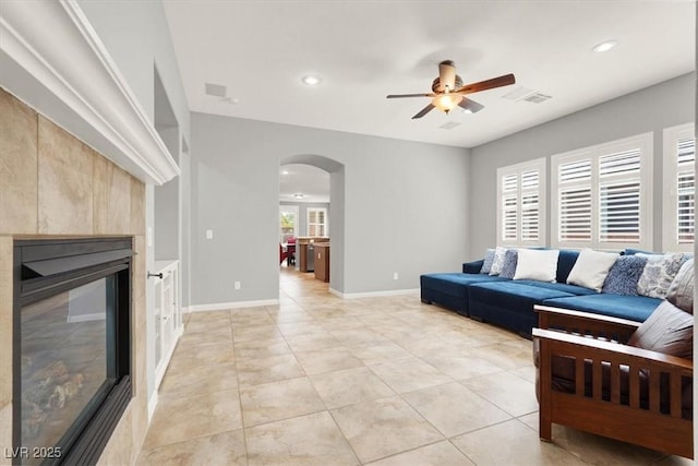 7806 Sundial Peak St, Las Vegas, NV 89166 - living area featuring arched walkways, ceiling fan, recessed lighting, light tile patterned floors, and baseboards