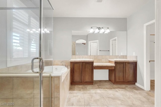 7806 Sundial Peak St, Las Vegas, NV 89166 - full bath with double vanity, a bath, a shower stall, and tile patterned flooring