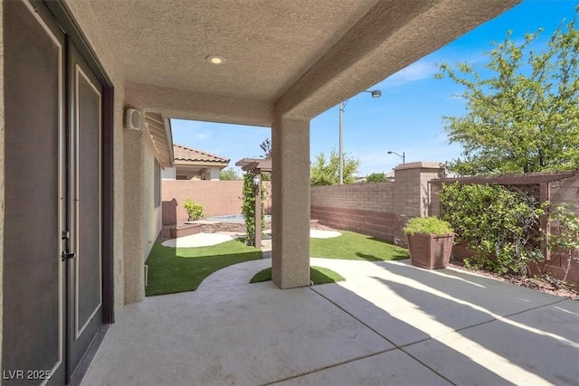 7806 Sundial Peak St, Las Vegas, NV 89166 - fenced backyard with a patio area