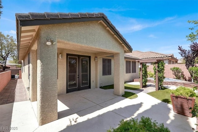 7806 Sundial Peak St, Las Vegas, NV 89166 - back of house with stucco siding, a patio area, and a fenced backyard