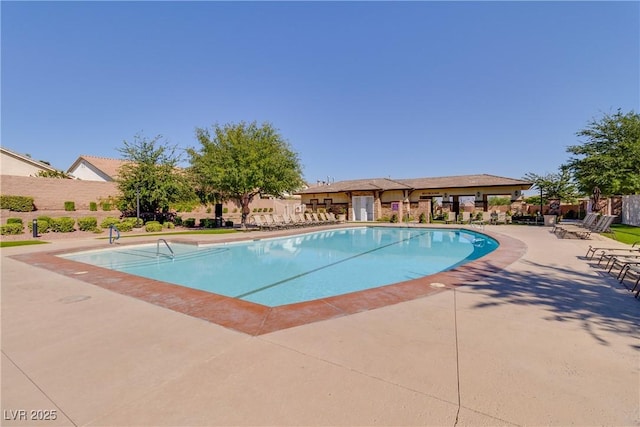 7806 Sundial Peak St, Las Vegas, NV 89166 - community pool featuring a patio area
