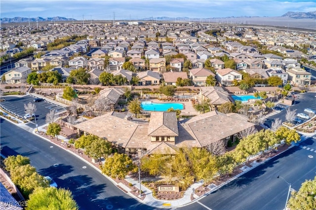 7806 Sundial Peak St, Las Vegas, NV 89166 - aerial view of residential area featuring a pool and mountains