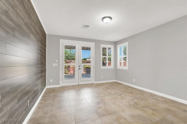 7806 Sundial Peak St, Las Vegas, NV 89166 - spare room featuring baseboards and light tile patterned floors