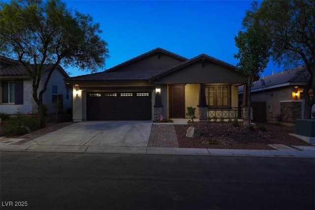 7806 Sundial Peak St, Las Vegas, NV 89166 - view of front of house with driveway, an attached garage, a porch, and stucco siding
