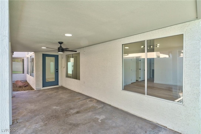 view of patio featuring ceiling fan