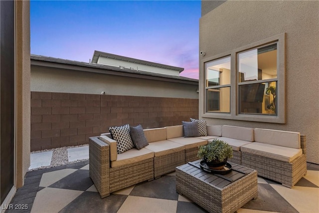 view of patio featuring fence and an outdoor hangout area