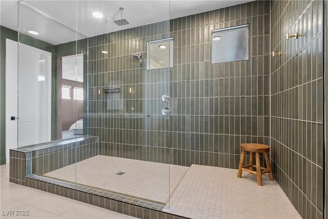 full bathroom featuring a walk in shower and tile patterned flooring