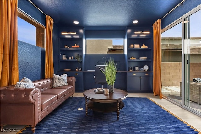 interior space featuring a textured ceiling, plenty of natural light, and recessed lighting