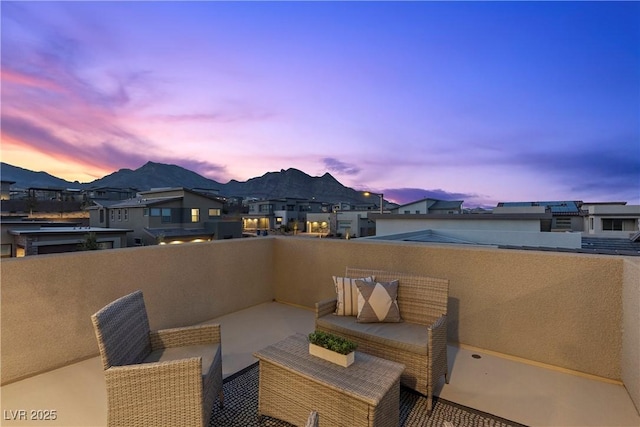 patio terrace at dusk with a balcony