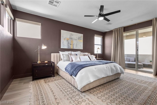 bedroom with light wood-style flooring, access to exterior, ceiling fan, and visible vents