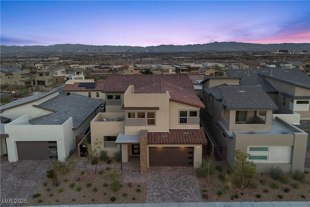 birds eye view of property with a mountain view and a residential view
