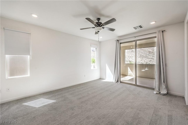 carpeted empty room featuring visible vents, a ceiling fan, baseboards, and recessed lighting