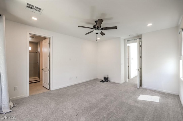 empty room with light carpet, a ceiling fan, recessed lighting, and visible vents