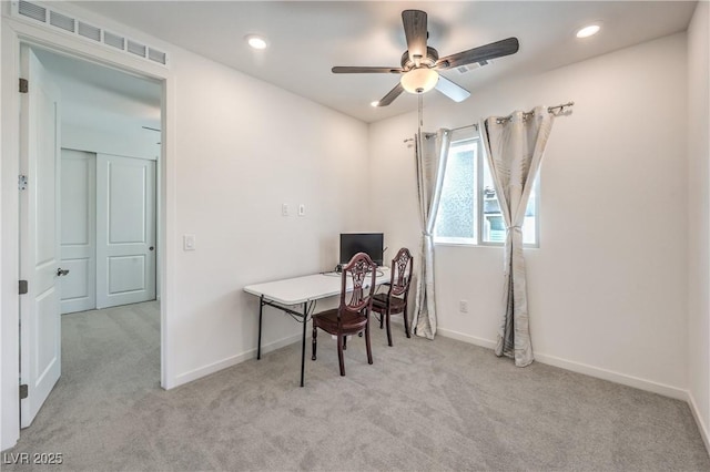 office area featuring carpet floors, ceiling fan, visible vents, and baseboards