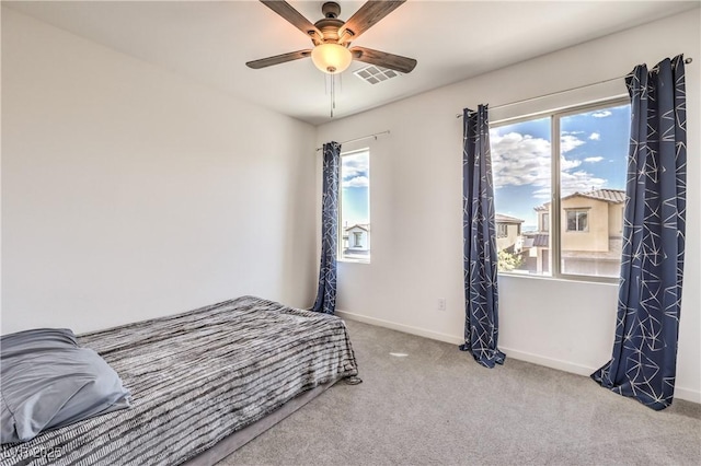 bedroom with visible vents, carpet, ceiling fan, and baseboards