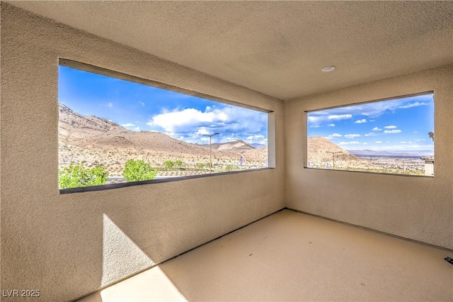 balcony featuring a mountain view