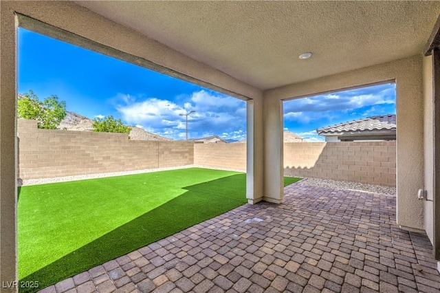 view of patio with a fenced backyard