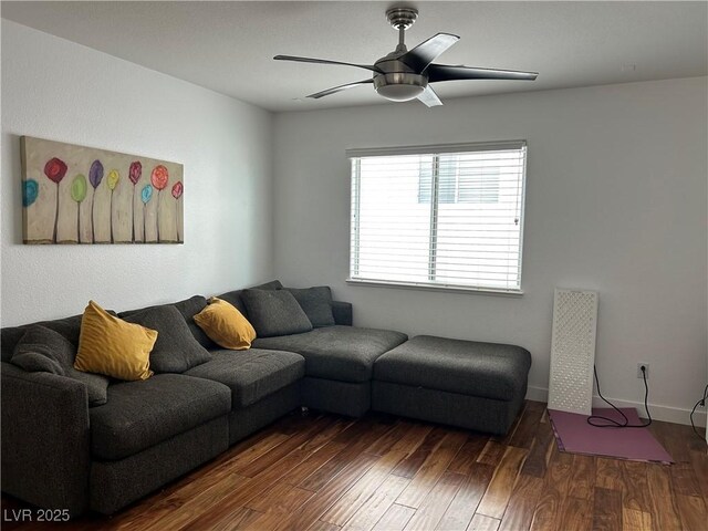 living area with ceiling fan and wood finished floors