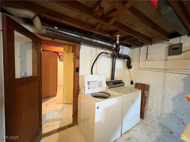 washroom featuring washer and clothes dryer and laundry area