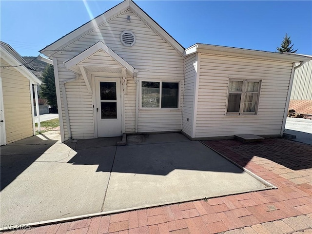rear view of house featuring a patio