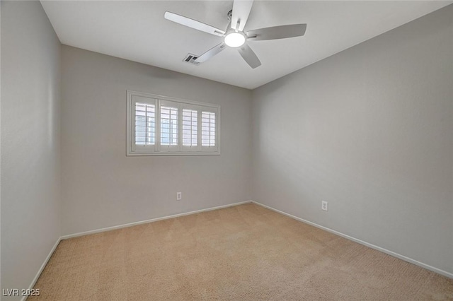 empty room with light carpet, ceiling fan, baseboards, and visible vents