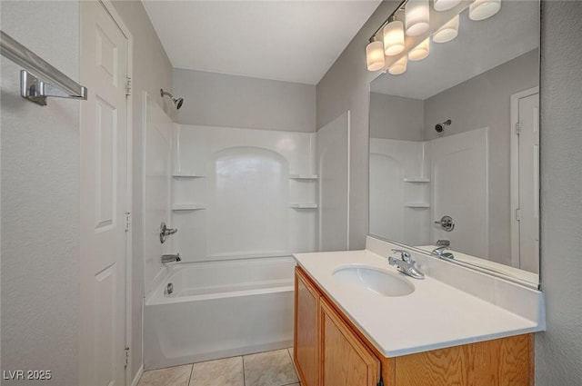 full bath featuring tile patterned flooring, vanity, and  shower combination