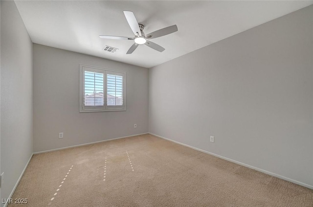 unfurnished room featuring visible vents, baseboards, a ceiling fan, and light carpet