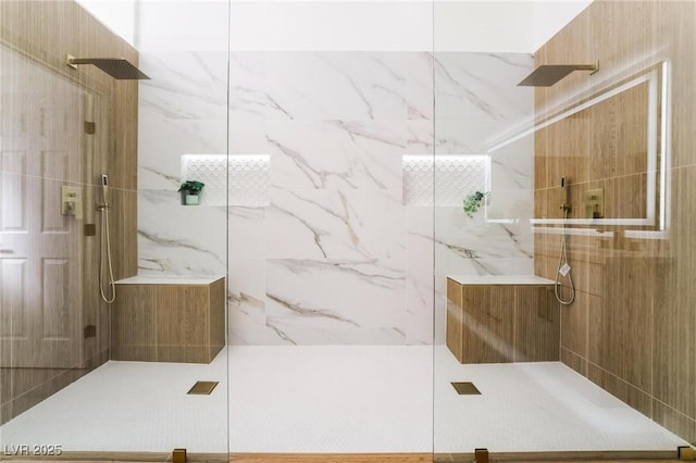full bathroom with a marble finish shower