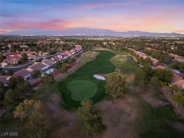 aerial view featuring a mountain view, golf course view, and a residential view