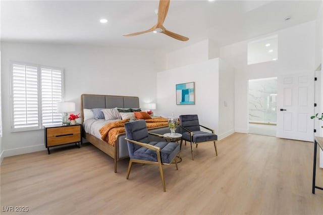 bedroom with light wood-style flooring, ensuite bathroom, baseboards, and recessed lighting