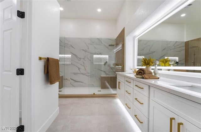 full bath featuring tile patterned flooring, recessed lighting, a sink, a marble finish shower, and double vanity