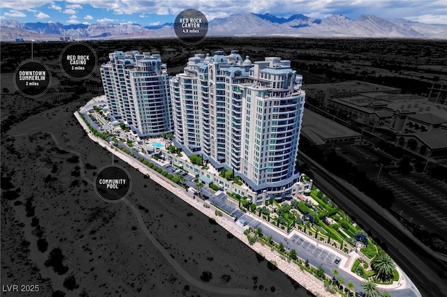 birds eye view of property with a mountain view