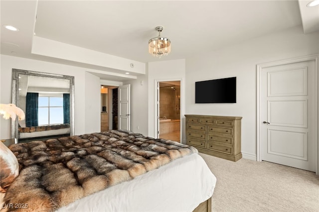 carpeted bedroom featuring ensuite bath, a notable chandelier, baseboards, and recessed lighting