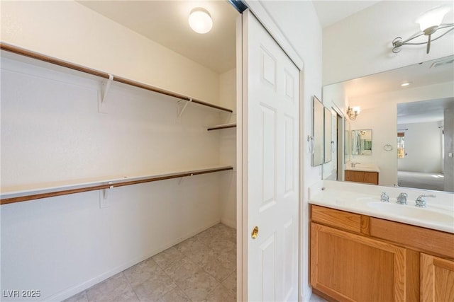 853 Ashford Way, Henderson, NV 89015 - full bath featuring visible vents, a spacious closet, and vanity