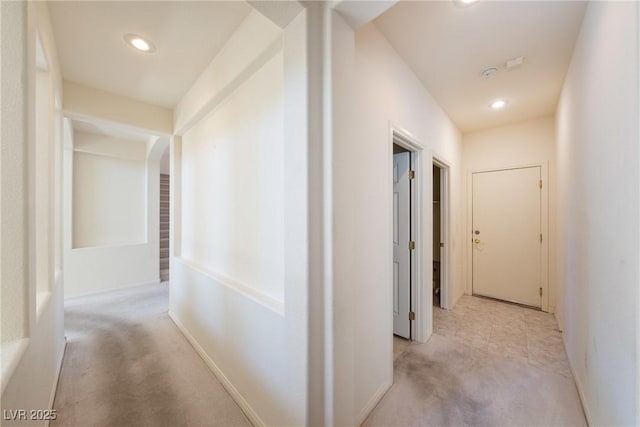 853 Ashford Way, Henderson, NV 89015 - hallway with recessed lighting, arched walkways, and light carpet