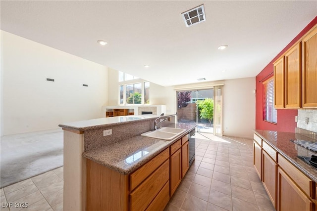 853 Ashford Way, Henderson, NV 89015 - kitchen featuring visible vents, a center island with sink, stainless steel dishwasher, light colored carpet, and a sink