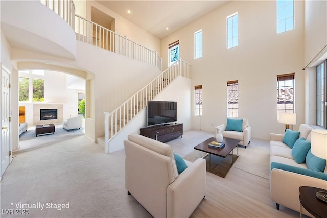 853 Ashford Way, Henderson, NV 89015 - living room with a wealth of natural light, stairway, and a towering ceiling