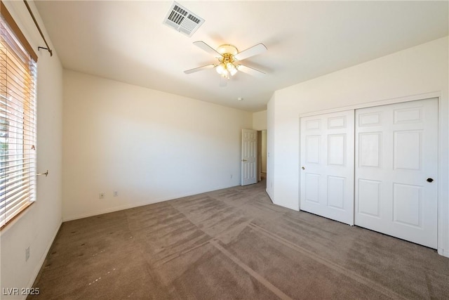 853 Ashford Way, Henderson, NV 89015 - unfurnished bedroom with a closet, carpet flooring, visible vents, and multiple windows