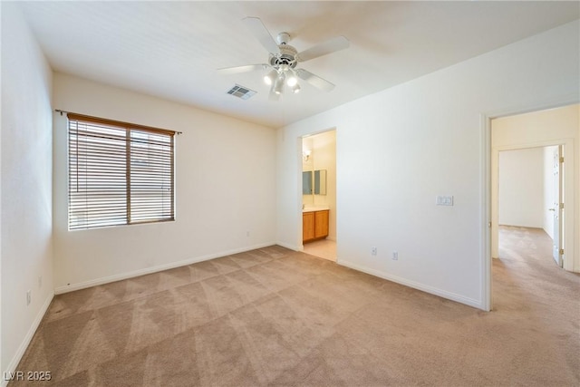 853 Ashford Way, Henderson, NV 89015 - unfurnished room with light colored carpet, baseboards, a ceiling fan, and visible vents