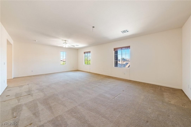853 Ashford Way, Henderson, NV 89015 - empty room with baseboards, visible vents, light colored carpet, and a ceiling fan