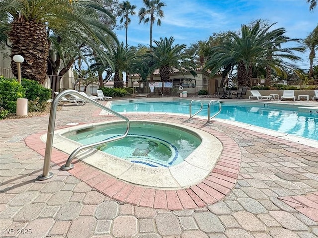 6480 Annie Oakley Dr Unit 511, Las Vegas, NV 89120 - pool featuring fence, a patio, and a hot tub