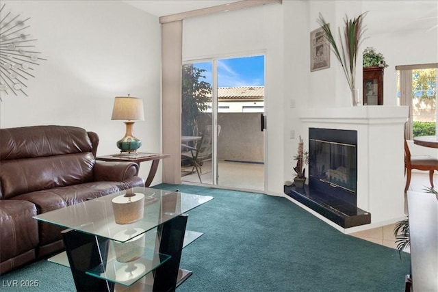 6480 Annie Oakley Dr Unit 511, Las Vegas, NV 89120 - carpeted living area featuring a glass covered fireplace